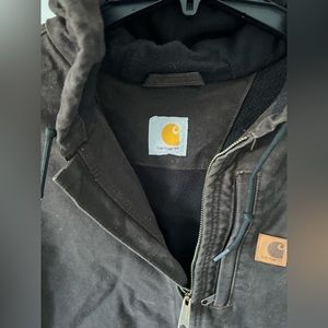 Men’s Brown Carhartt Vest. Size 3XL tags ripped off. Black fleece interior.